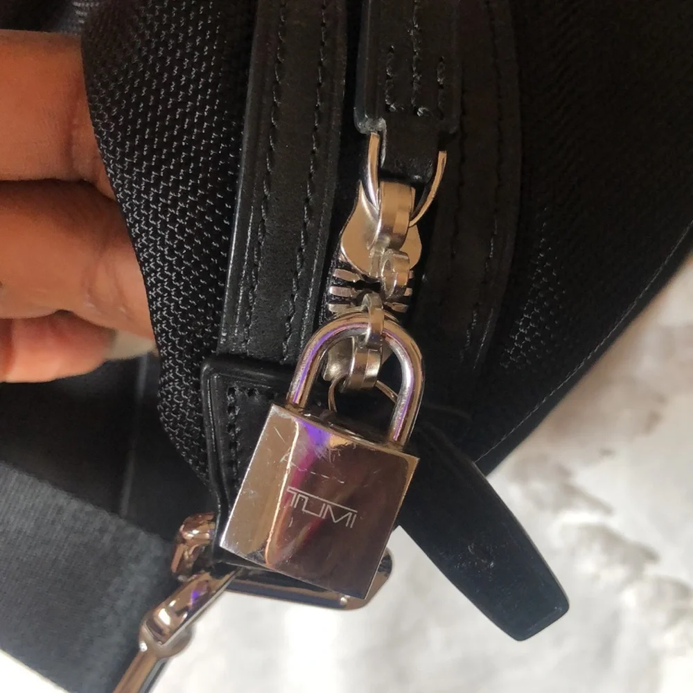 TUMI black Boston 2 way leather and canvas and mini lock. Detachable straps.